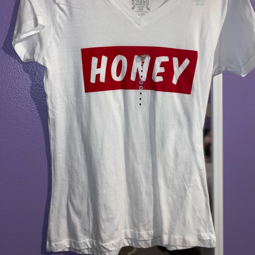 White tee with red letters